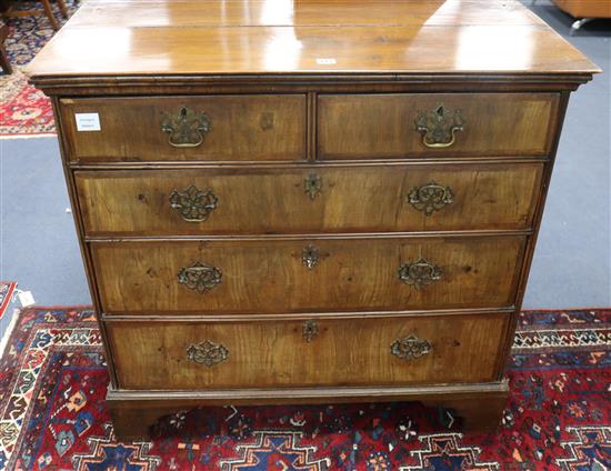 A George III walnut chest of five drawers W.98cm